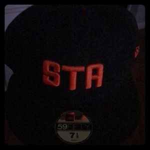 Black New Era STA fitted hat with logo in orange